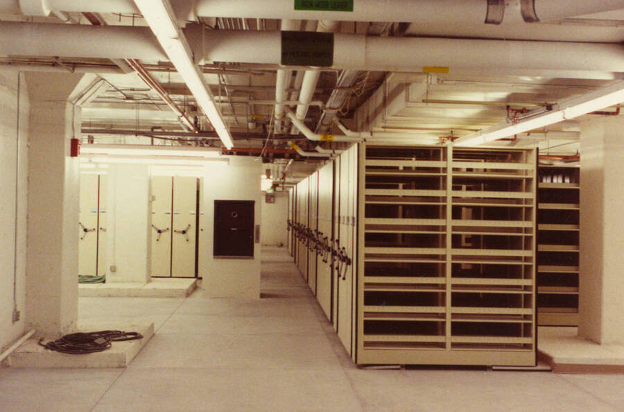 December 15, 1988 photograph of the Library. Compact shelving in basement. Donor: Monte Steiger. [PG1_122-105b]