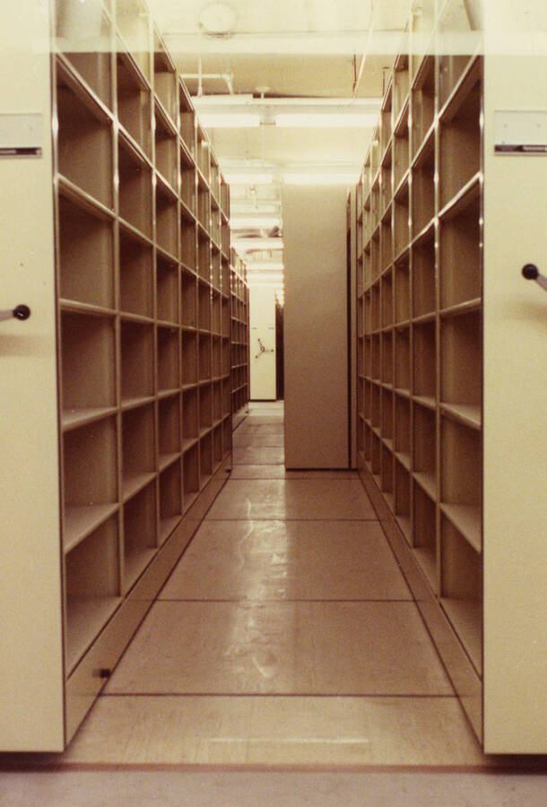 December 15, 1988 photograph of the Library. Compact shelving in basement. Donor: Monte Steiger. [PG1_122-105e]