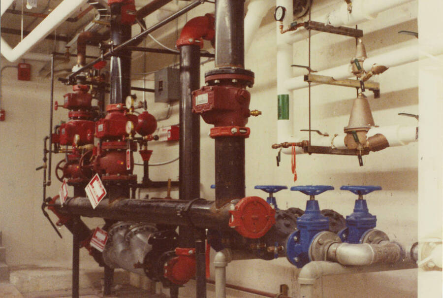 December 15, 1988 photograph of the Library. Pipes in basement. Donor: Monte Steiger. [PG1_122-105f]