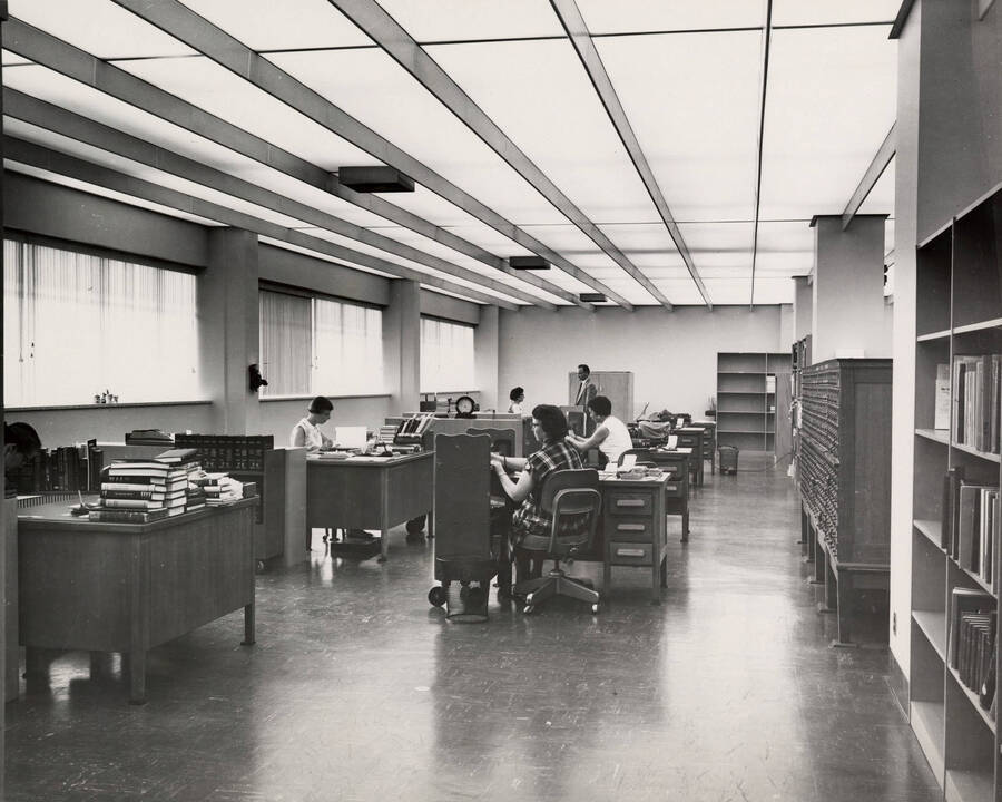 1957 photograph of the Library. Technical services department. [PG1_122-011]