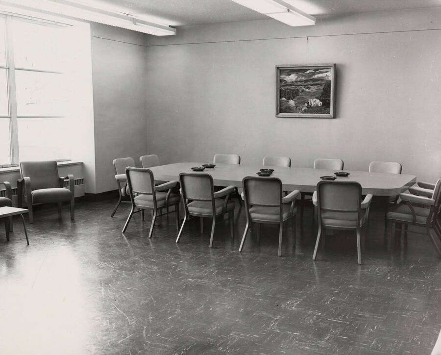 1957 photograph of the Library. Large conference room with ashtrays. [PG1_122-031]