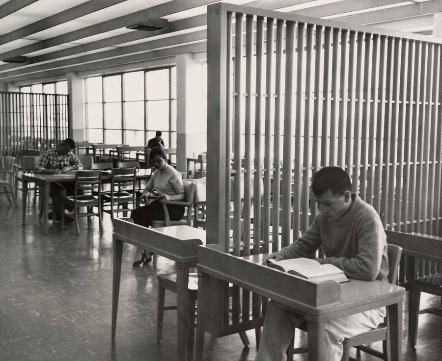 1957 photograph of the Library. Students studying at tables. [PG1_122-055]
