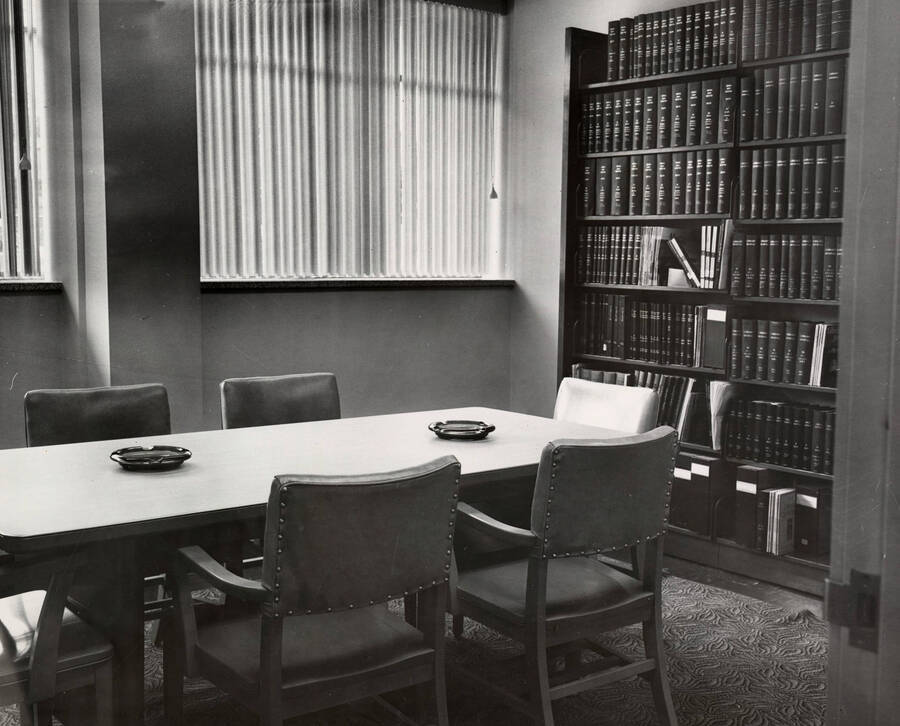 1957 photograph of the Library. Scene of conference room complete with ashtrays. [PG1_122-008]