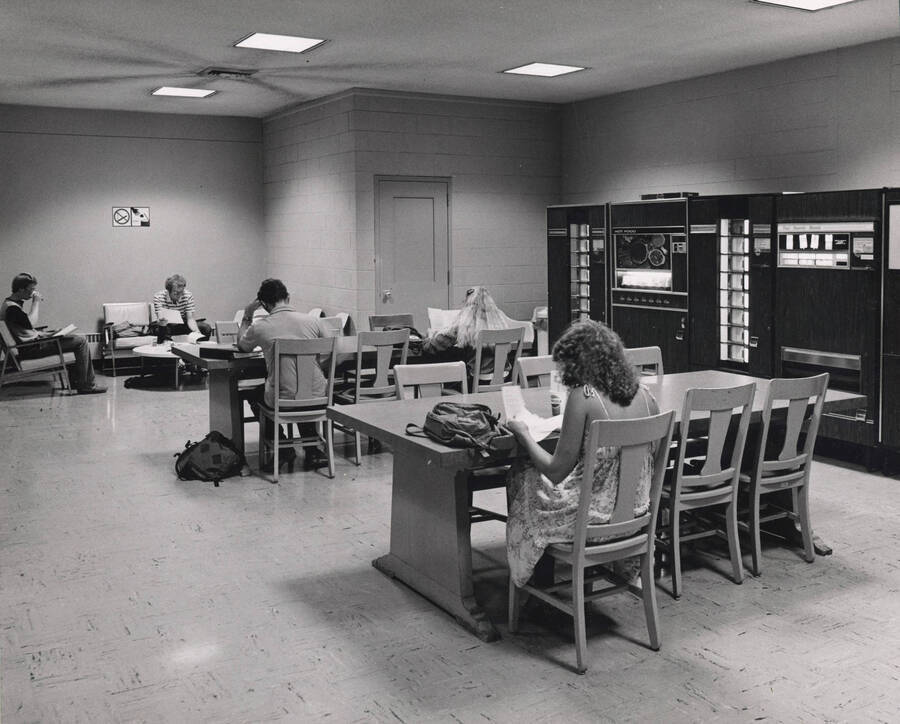 October 1, 1982 photograph of the Library. Students study in a lounge area. [PG1_122-098]