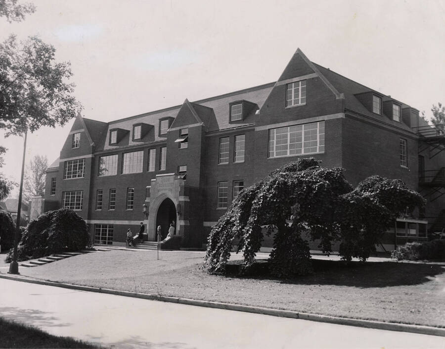 1953 photograph of the Home Economics Building. Students on the steps in background. [PG1_123-02]