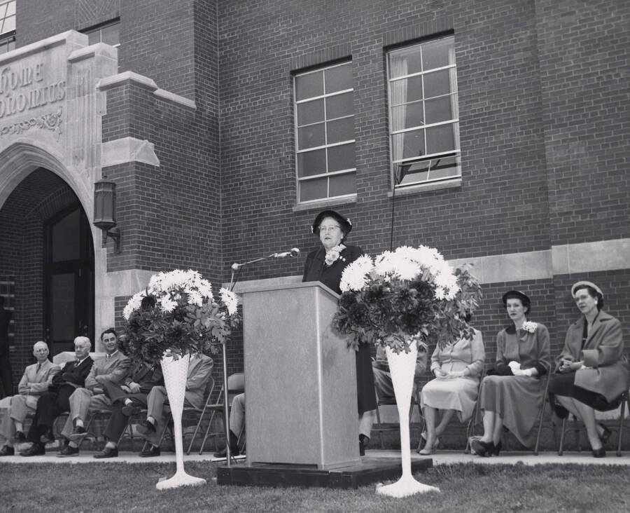 1953 photograph of the Home Economics Building dedication ceremony. Mrs. Marguerite Campbell at lectern. [PG1_123-03]