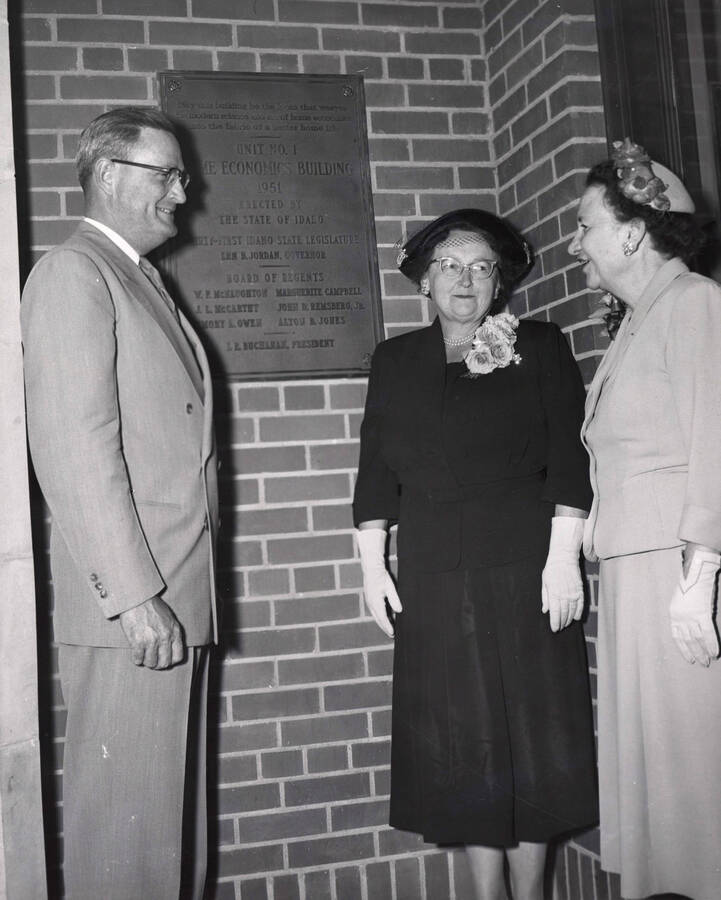 1953 photograph of the Home Economics Building dedication ceremony. Left to right: President Buchanan, Marguerite Campbell, Margaret Ritchie next to dedicatory plaque. [PG1_123-07]