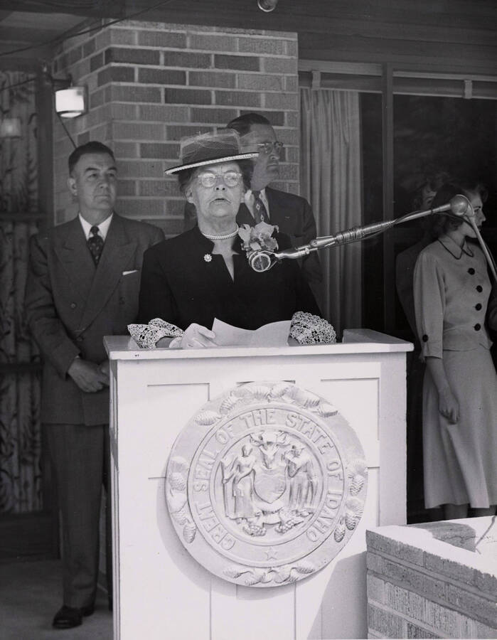 1953 photograph of the Ethel Steel House dedication ceremony. Mrs. Ethel Steel at lectern. [PG1_124-02]