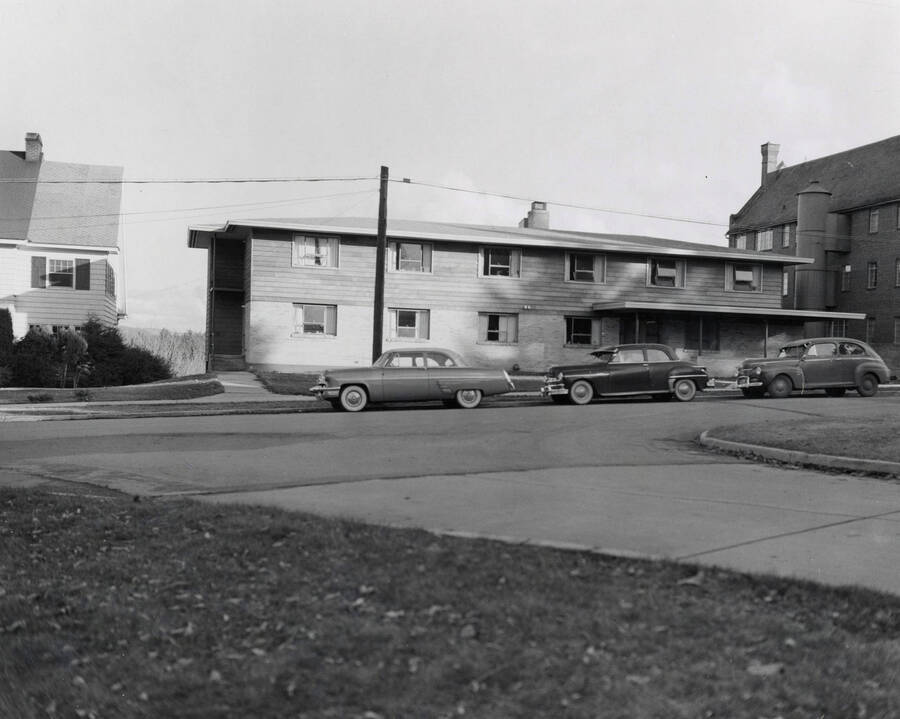 1953 photograph of the Ethel Steel House. Automobiles in foreground. [PG1_124-06]