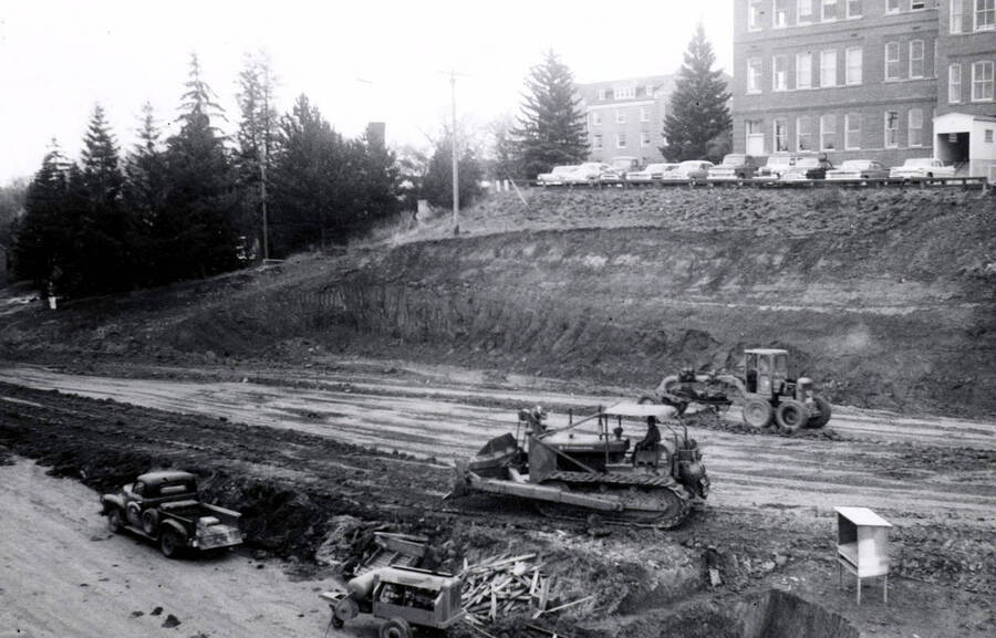 1960 photograph of the Mines Building under construction. Construction workers on equipment in foreground. Donor: College of Mines. [PG1_125-01]