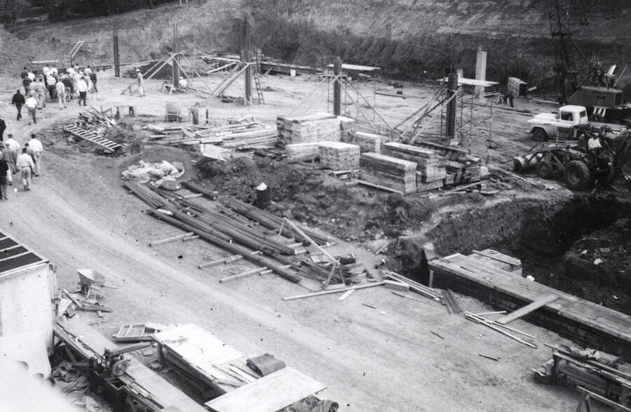 1960 photograph of the Mines Building under construction. Students to the left. Donor: College of Mines. [PG1_125-03]