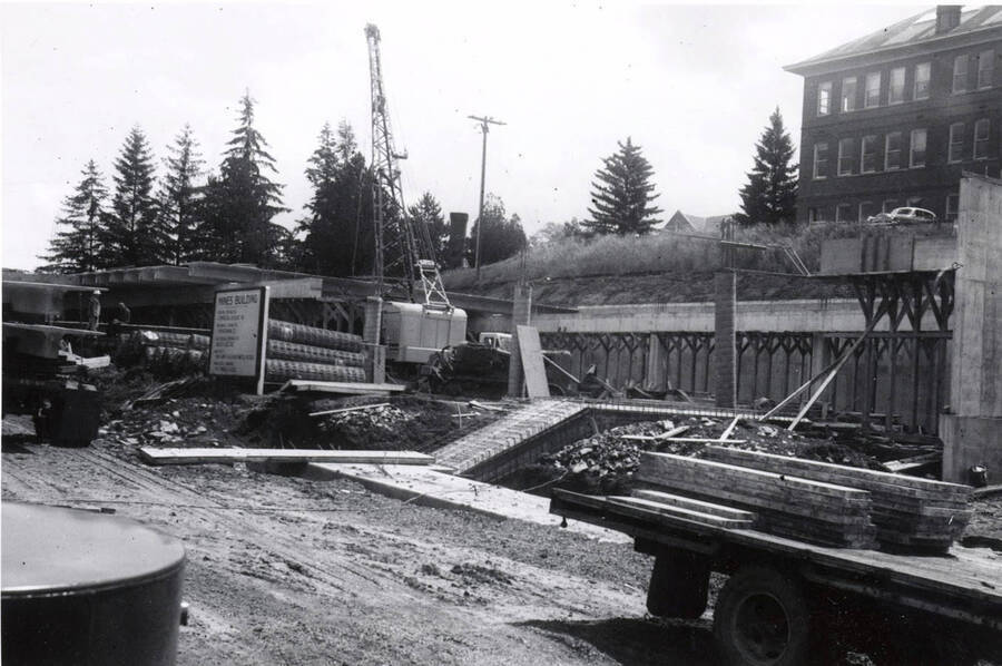 1960 photograph of the Mines Building under construction. Construction equipment in foreground. Donor: College of Mines. [PG1_125-06]