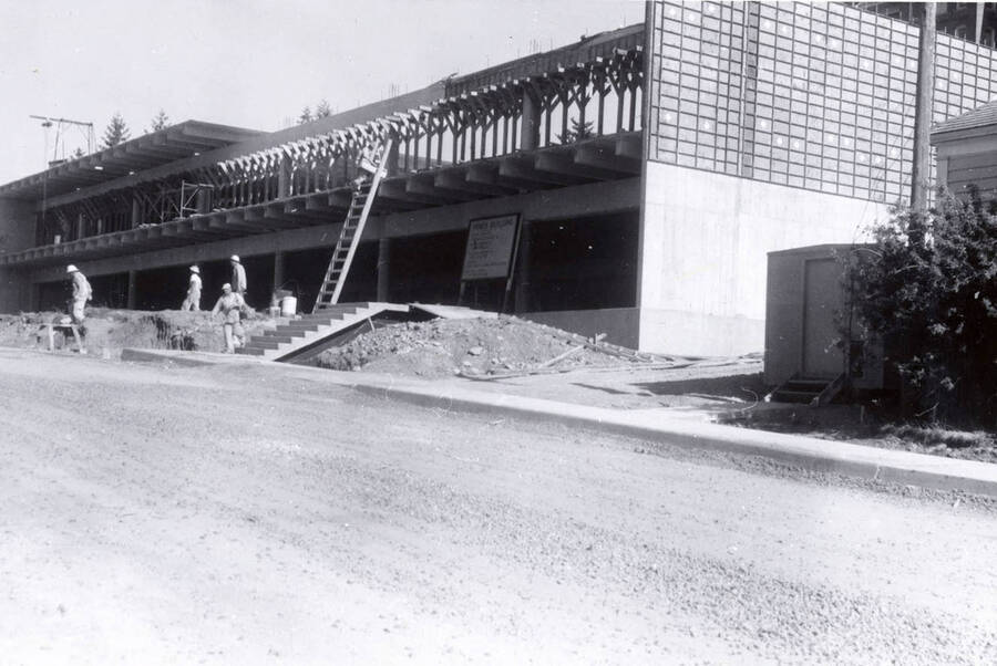 1960 photograph of the Mines Building under construction. Construction workers to the left. Donor: College of Mines. [PG1_125-08]