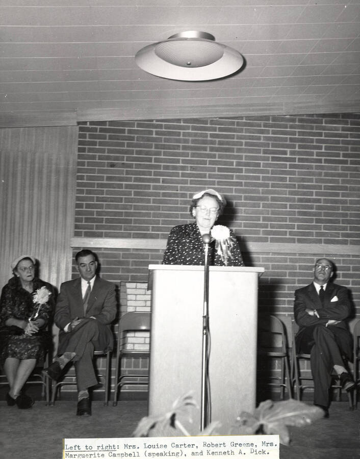 1954 photograph of the Permeal J French House dedication ceremony. Left to right: Louise Carter, Robert Greene, Marguerite Campbell, Kenneth A. Dick. [PG1_126-02]