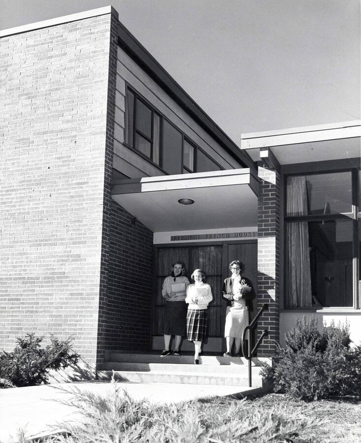 1954 photograph of the Permeal J French House. Students leave the building in center. Donor: Publications Dept. [PG1_126-04]
