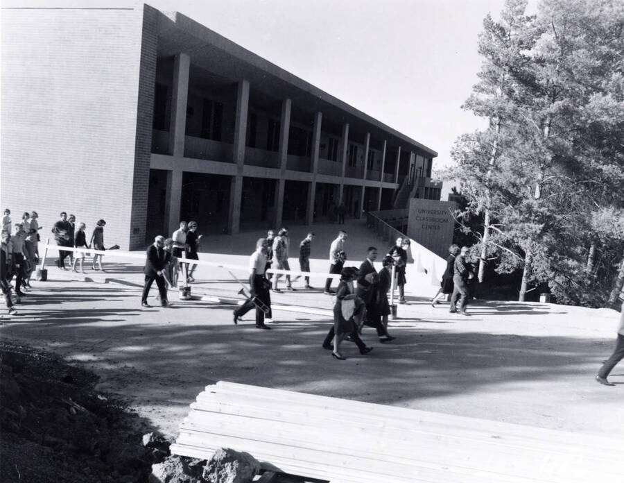 1965 photograph of University Classroom Center. Group of people in foreground. [PG1_128-16]