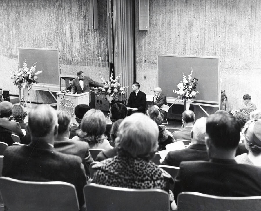 1965 photograph of the University Classroom Center dedication. President Hartung at lectern. Donor: Publications Dept. [PG1_128-03]