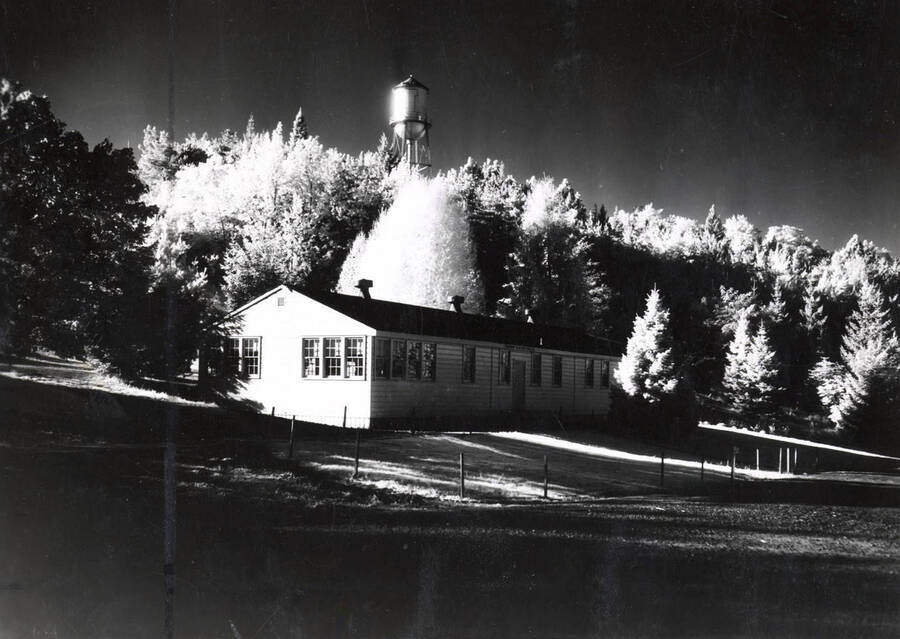 1952 photograph of the Communications (Radio-TV) Building. Water tower in background. [PG1_130-02]