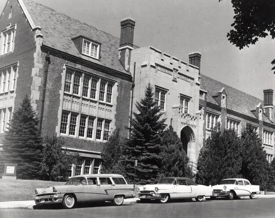 1956 photograph of Life Sciences Building. Automobiles in foreground. [PG1_132-05]