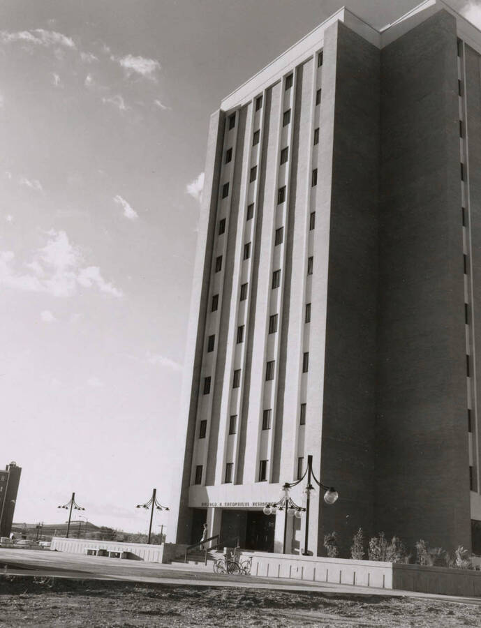 1970 photograph of the Donald R Theophilus Residence Hall. Lampposts in foreground. [PG1_134-12]