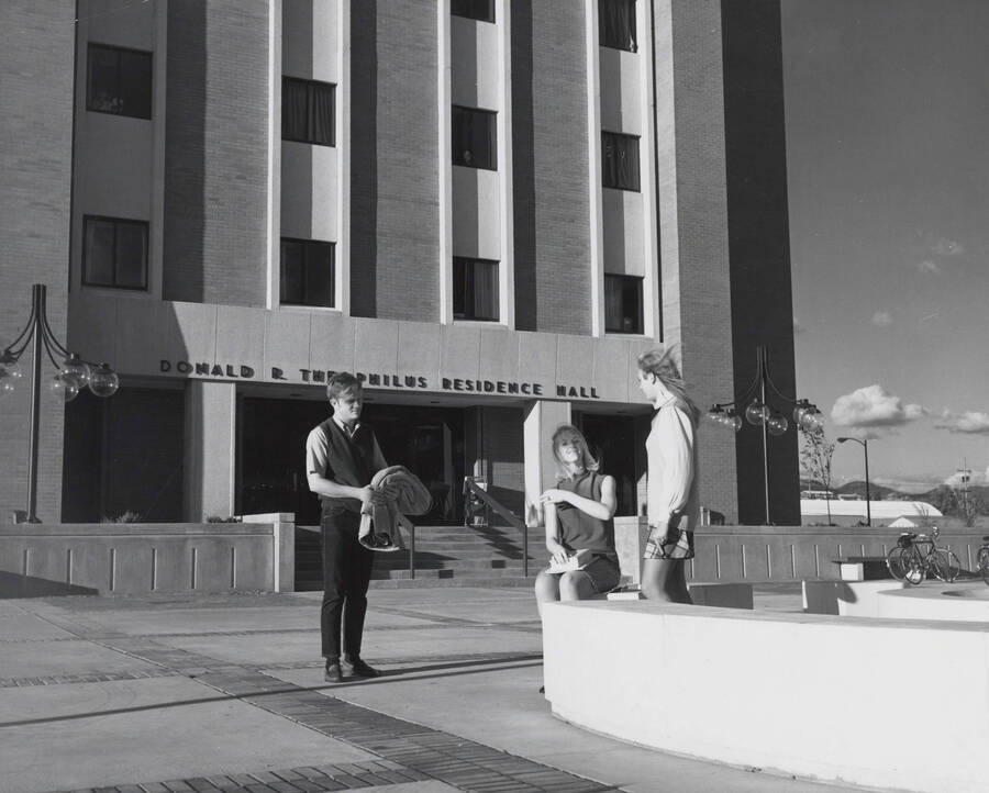 1969 photograph of the Donald R Theophilus Residence Hall. Students near entrance. Donor: Publications Dept. [PG1_134-03]