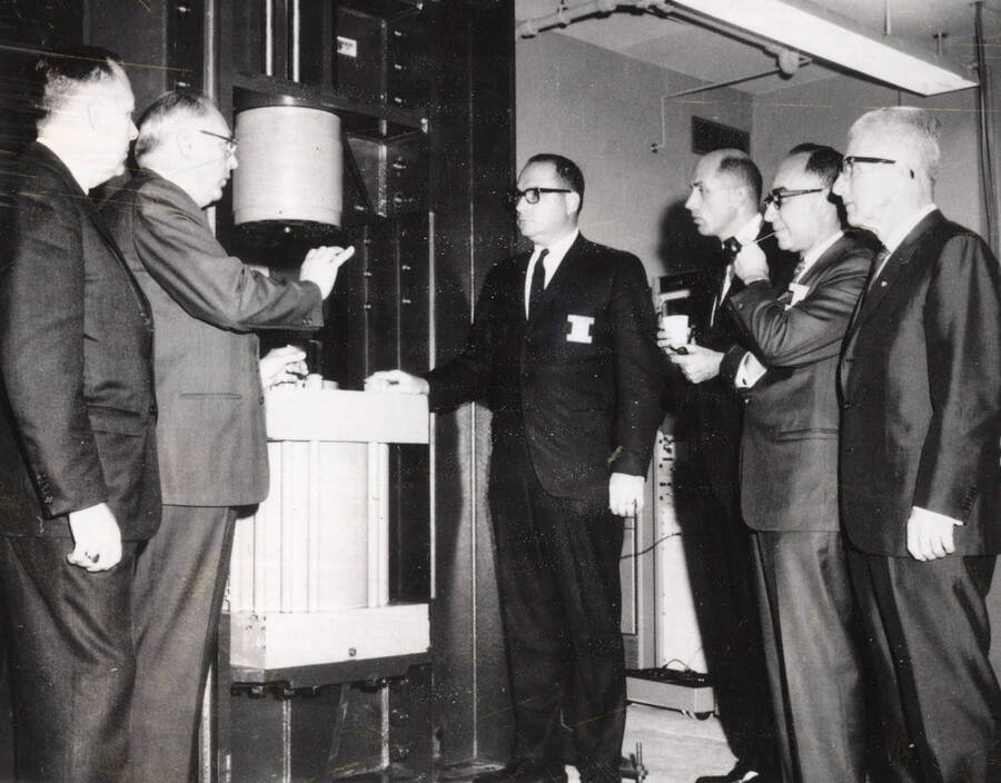 1968 photograph of the Buchanan Engineering Laboratory. Left to right: G.B. Bennett, H.S. Smith, J.K. Sullivan, C.M. Duffy, L.W. Ruth, Frank Edwards. Donor: Publications Dept. [PG1_137-01]