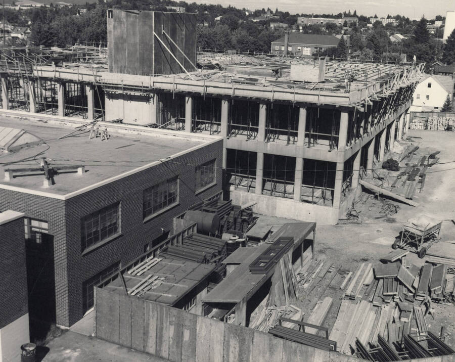 1969 photograph of the Buchanan Engineering Laboratory under construction. Houses in background. [PG1_137-09]
