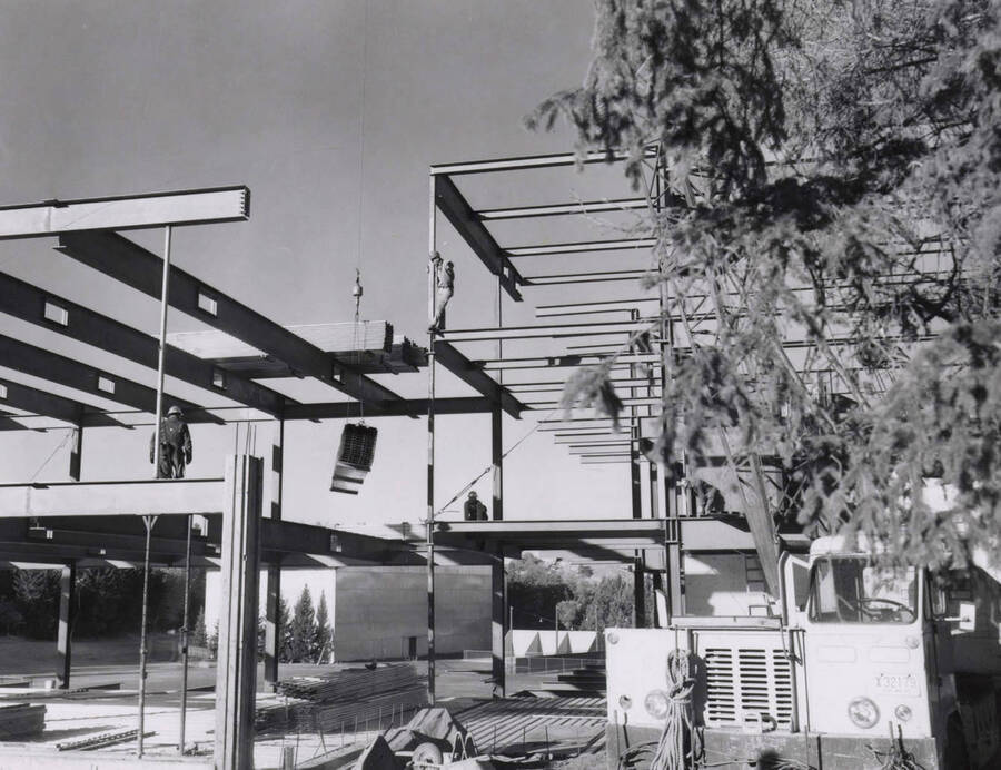 1968 photograph of the Education Building under construction. Construction workers in foreground. [PG1_139-14]