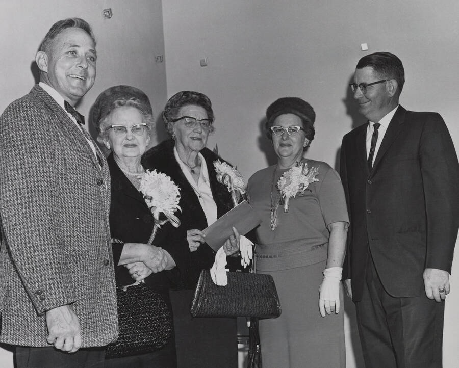 1965 photograph of the Wallace Residence Center dedication of new addition. Left to right: President Ernest Hartung, Mrs. J.E. Graham, Louise Carter, Mr. and Mrs. Harold Snow. [PG1_141-13]