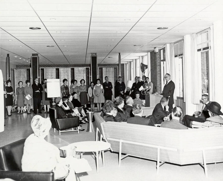 1963 photograph of the Wallace Residence Center dedication ceremony. Ezra M. Hawkes at lectern. Donor: Publications Dept. [PG1_141-04]
