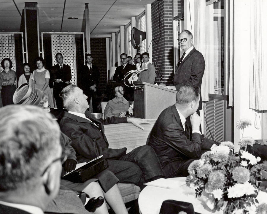 1963 photograph of the Wallace Residence Center dedication ceremony. Ezra M. Hawkes at lectern. Donor: Publications Dept. [PG1_141-05]