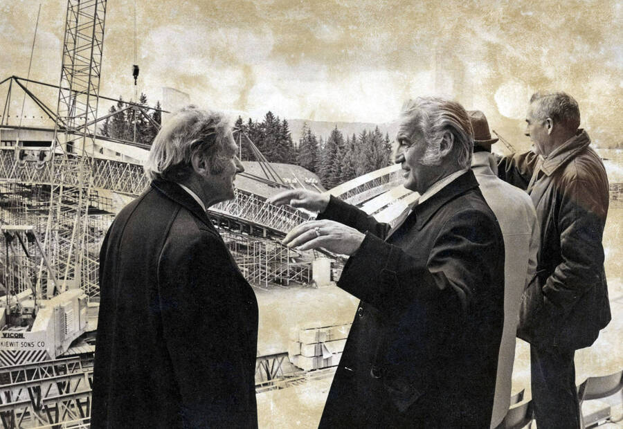 1975 photograph of the Kibbie-ASUI Activity Center under construction. William H. Kibbie and President Hartung before first beam raising. [PG1_147-02]