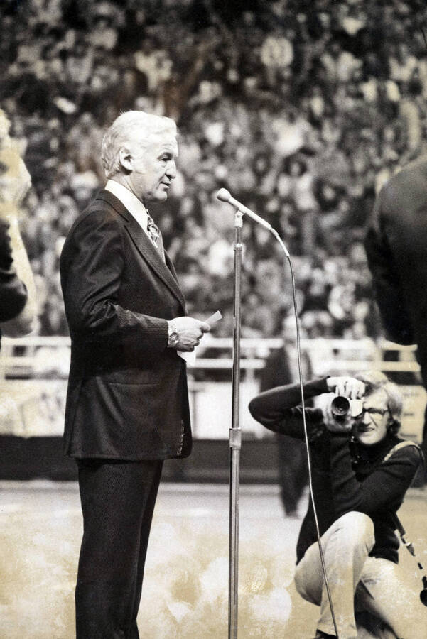 1975 photograph of the Kibbie-ASUI Activity Center dedication ceremony. William H Kibbie stands at microphone. [PG1_147-21]