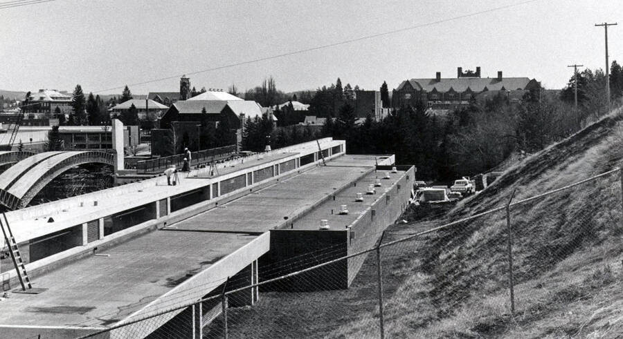 1975 photograph of the Kibbie-ASUI Activity Center under construction. Administration Building in background. Donor: U of I Alumni Office. [PG1_147-26]