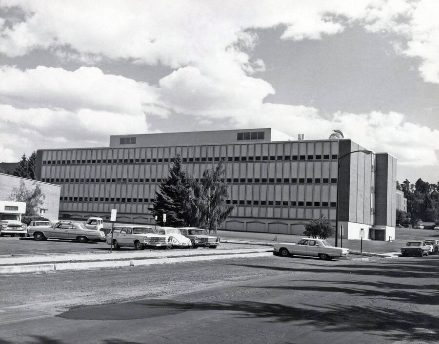 1968 photograph of Renfrew Hall (Physical Science Building). Automobiles in foreground. [PG1_148-06]