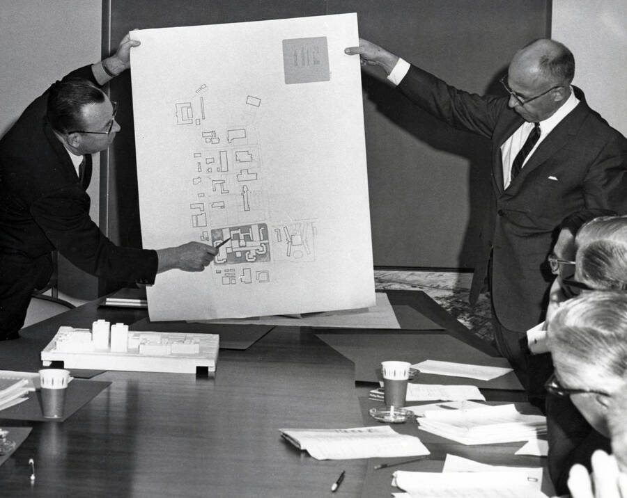 1966 photograph of George Gagon presenting plans for new dormitory complex to the Board of Regents. Donor: Publications Dept. [PG1_151-01]