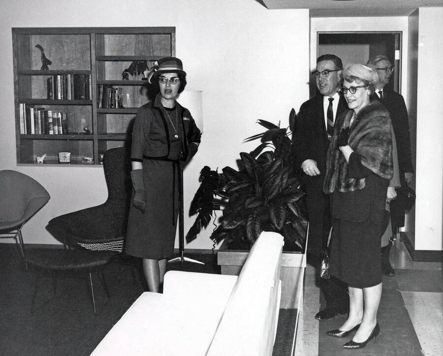 1965 photograph of the Home Management House. Left to right: Janet Latham, Head Resident, Mr. And Mrs. Elvin Hampton. Donor: Publications Dept. [PG1_153-02]