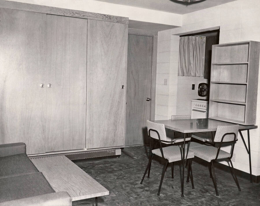 1957 photograph of the Park Village Apartments. Interior photo of a living room. Donor: Publications Dept. [PG1_154-05]