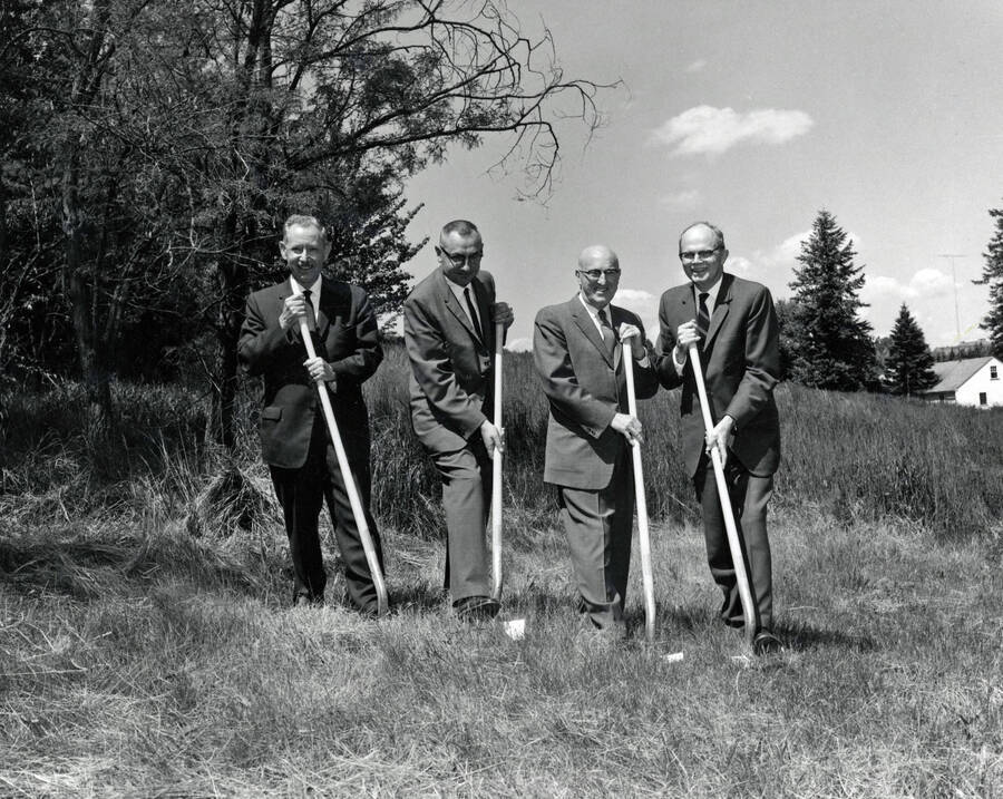 1962 photograph of the Forestry Sciences Laboratory groundbreaking ceremony. Left to right: James W. Kimmey, Ernest Wohletz, D.R. Theophilus, Reed Bailey. [PG1_158-03]