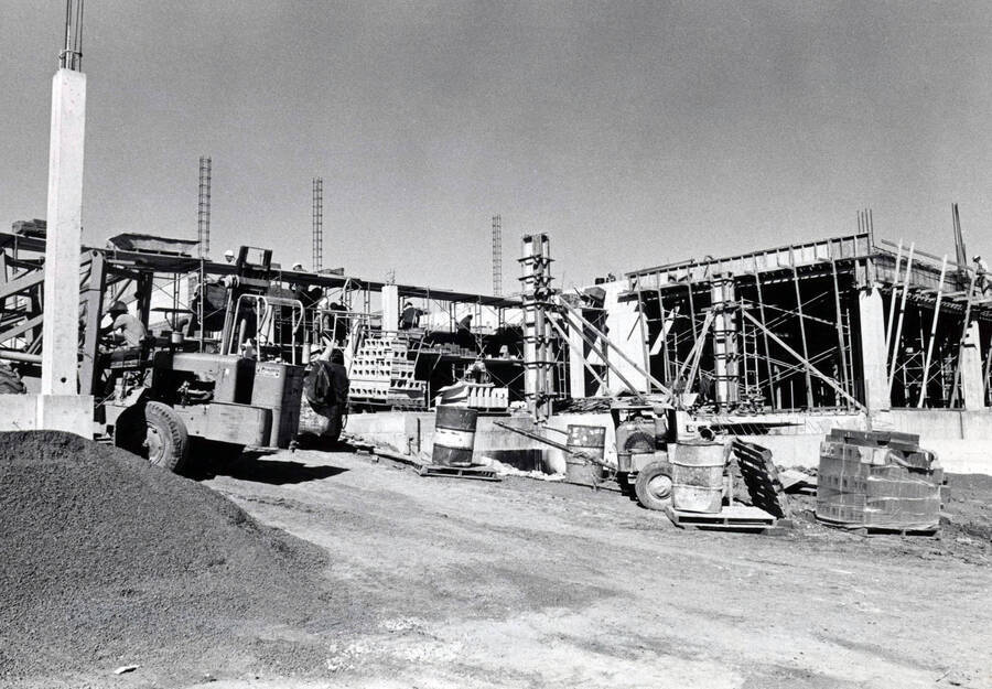 September 15, 1972 photograph of the Menard Law Building under construction. Construction equipment in foreground. [PG1_162-05]