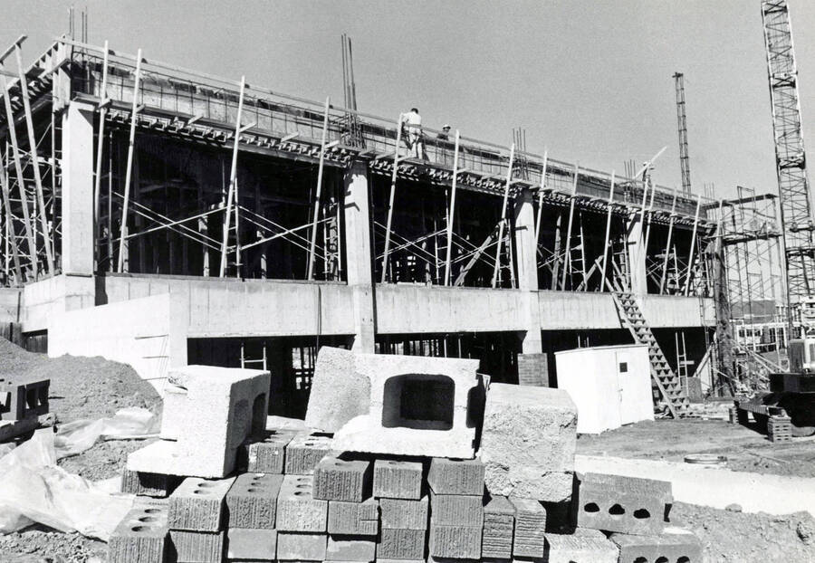 September 15, 1972 photograph of the Menard Law Building under construction. Bricks in foreground. [PG1_162-06]