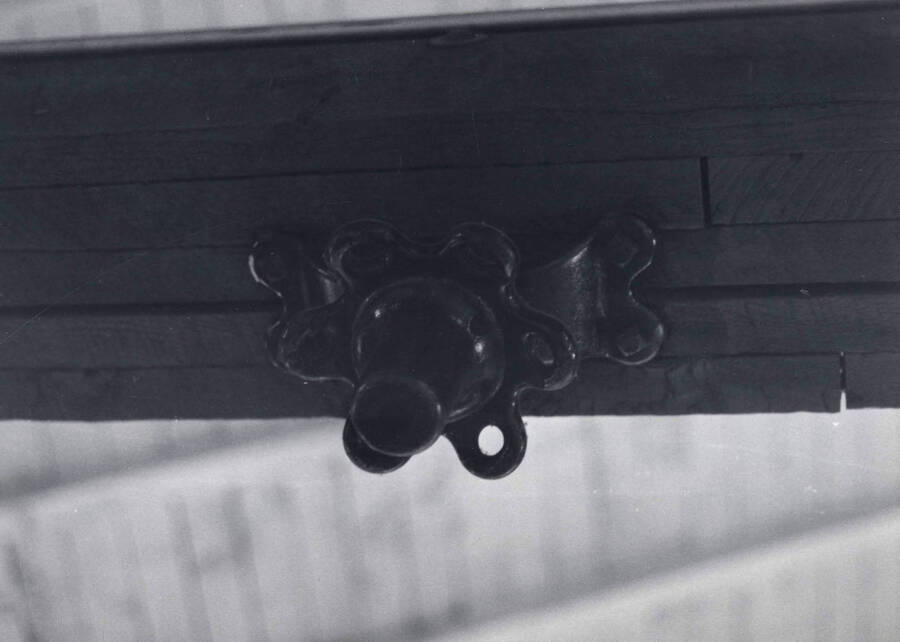 1975 photograph of Art and Architecture South. Detail of old gym hardware on roof beam. Donor: Karl Roenke. [PG1_167-13]