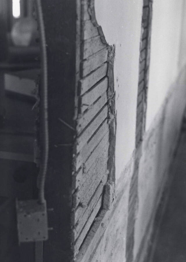 1976 photograph of Art and Architecture South. View of plaster and lathe revealed. Donor: Karl Roenke. [PG1_167-18]