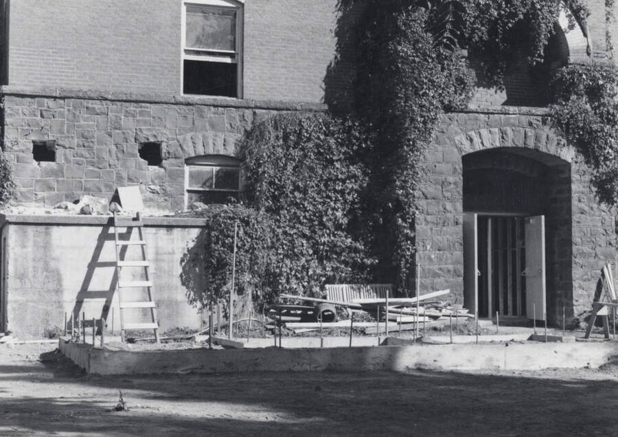 1976 photograph of Art and Architecture South under renovation. View of north section, west elevation showing entrance. Donor: Karl Roenke. [PG1_167-02]