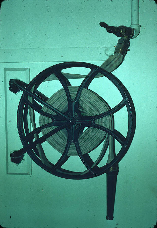 1975 photograph of Art and Architecture South during renovation. Detail of brass fire hose fittings in the basement. Donor: Karl Roenke and Robert Weaver, 1976. [PG1_167-064]