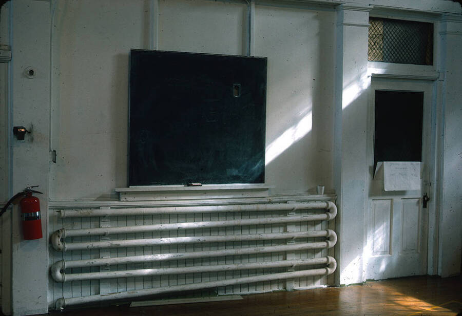 1975 photograph of Art and Architecture South during renovation. Radiator and chalkboard in foreground. Donor: Karl Roenke and Robert Weaver, 1976. [PG1_167-075]