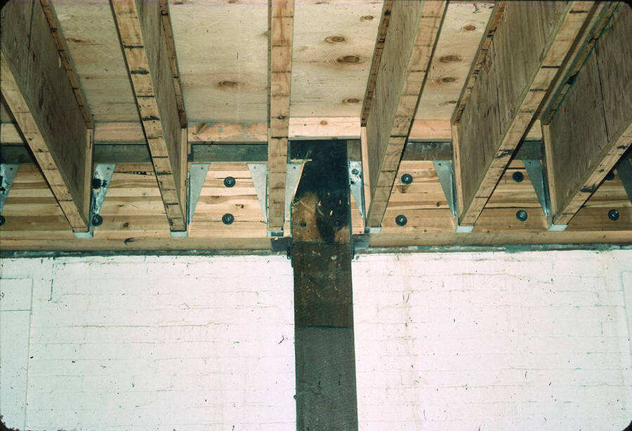 1975 photograph of Art and Architecture South during renovation. Detail of beam structure. Donor: Karl Roenke and Robert Weaver, 1976. [PG1_167-082]
