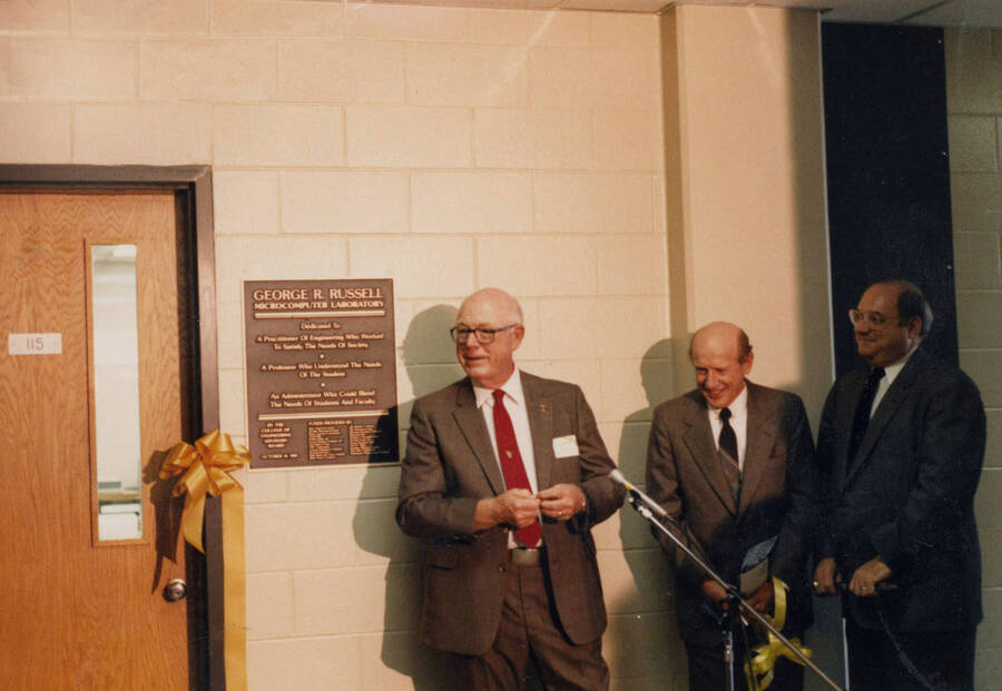 1985 photograph of the George R. Russell Microcomputer Laboratory dedication ceremony. Left to right: G.R. Russell, Richard Gibb, unidentified. Donor: UI Information, Marythea Grebner. [PG1_172-1]
