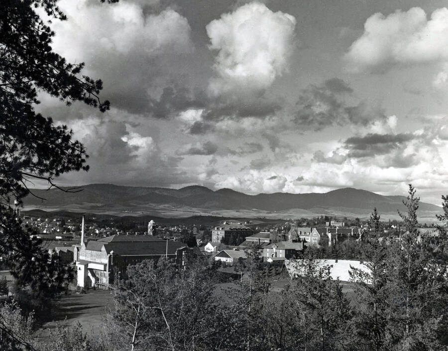 1930 panoramic photograph of University of Idaho campus. Grandstands in the foreground and Moscow Mountain in the background. [PG1_2-17]