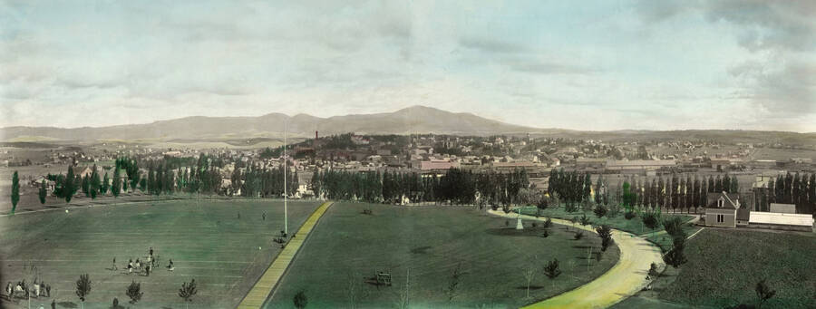 1920 panoramic hand painted photograph of University of Idaho campus. Athletic field in the foreground, Moscow Mountain in the background. Donor: Mrs. Eggan.. [PG1_002-21]
